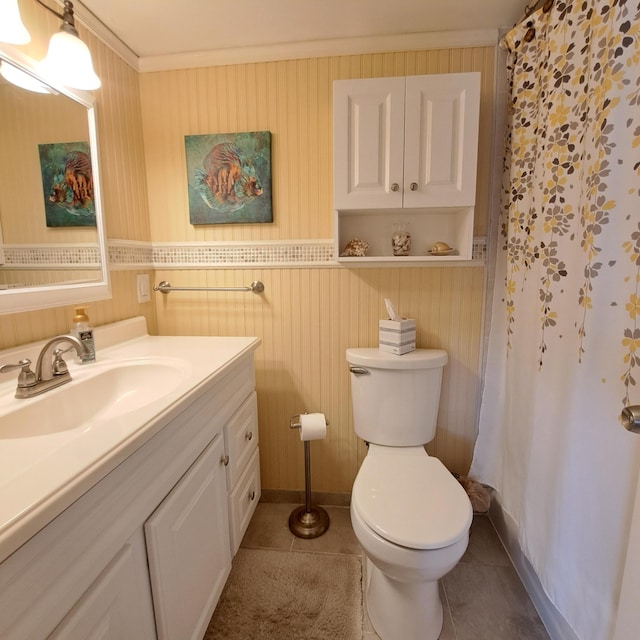 bathroom featuring crown molding, tile patterned floors, toilet, and vanity