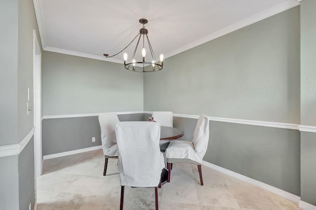 dining area with crown molding and a chandelier