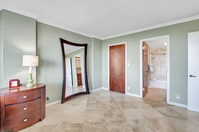 bedroom featuring crown molding and ensuite bath