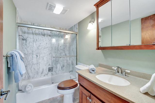 full bathroom with vanity, combined bath / shower with glass door, and toilet