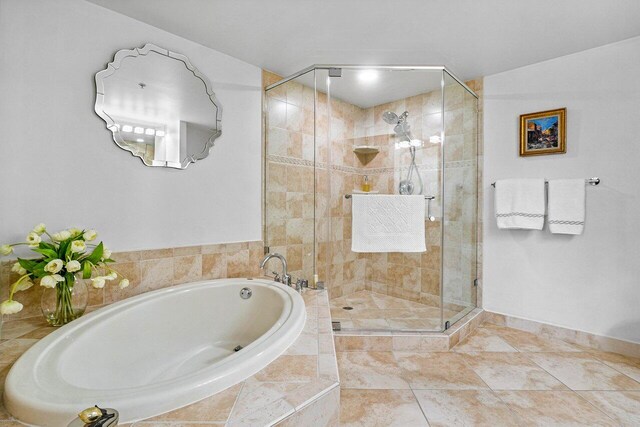 bathroom with tile patterned floors and plus walk in shower