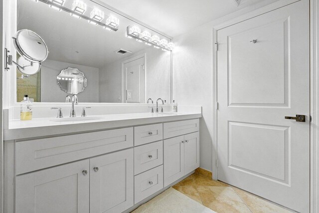 bathroom featuring vanity and tile patterned flooring