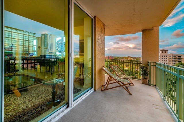 view of balcony at dusk