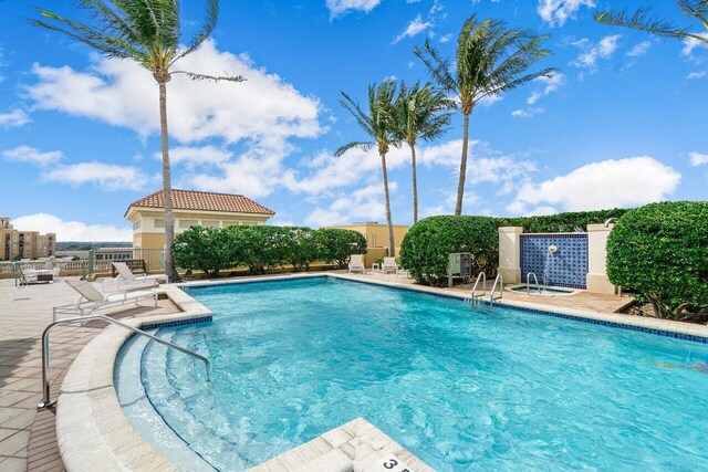 view of swimming pool with a patio