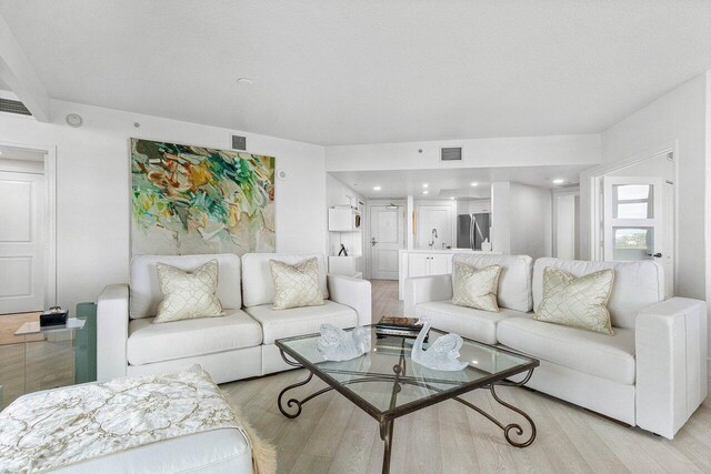 living room featuring light wood-type flooring