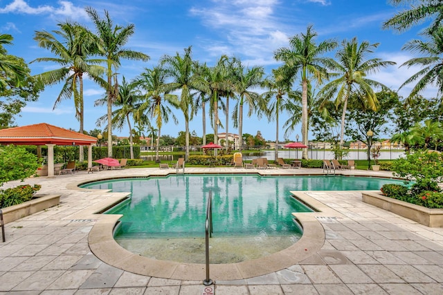 view of swimming pool featuring a patio and a gazebo