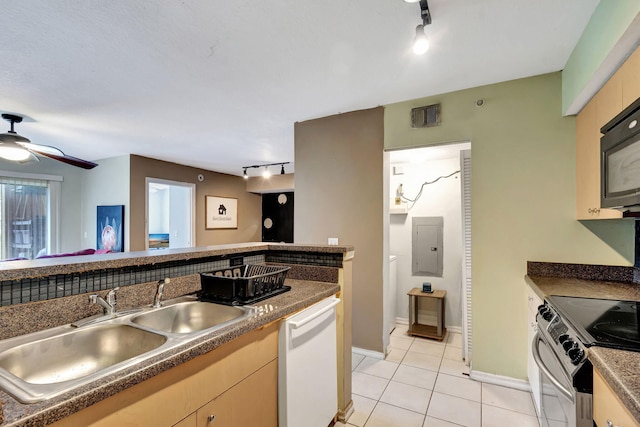 kitchen with sink, track lighting, white dishwasher, and stainless steel electric range oven