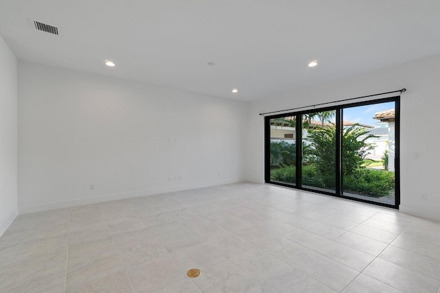 empty room with light tile patterned floors