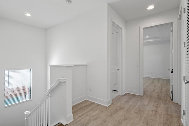 corridor featuring light hardwood / wood-style floors