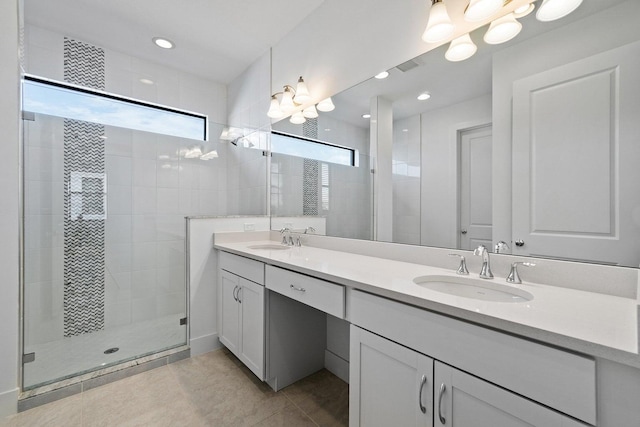 bathroom with vanity, tile patterned floors, and a shower with shower door