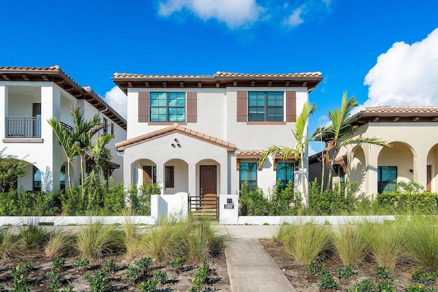 mediterranean / spanish house with a balcony