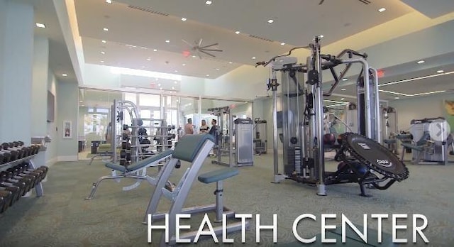 gym featuring a tray ceiling