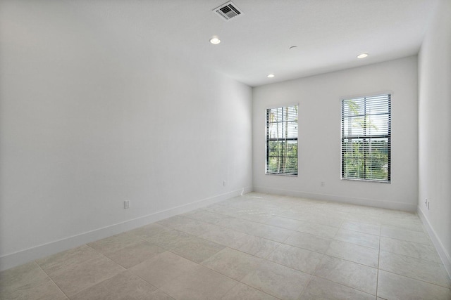 empty room featuring light tile patterned floors