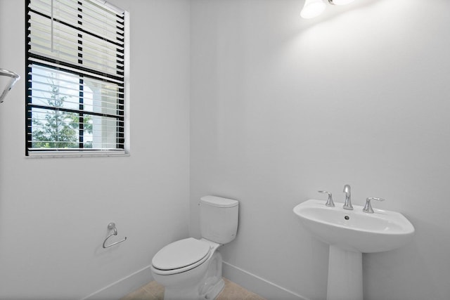 bathroom with tile patterned floors and toilet