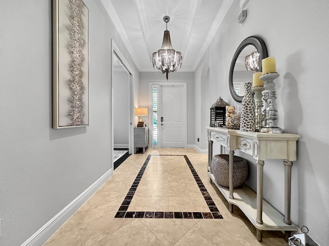 foyer entrance featuring crown molding, light tile patterned flooring, and a chandelier