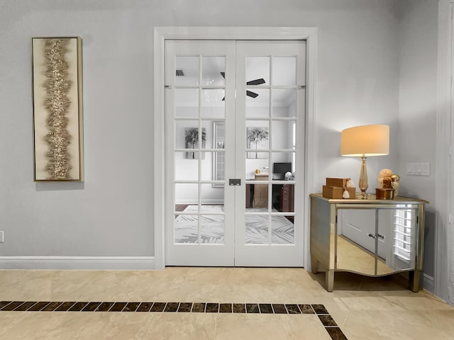 doorway with french doors and ceiling fan