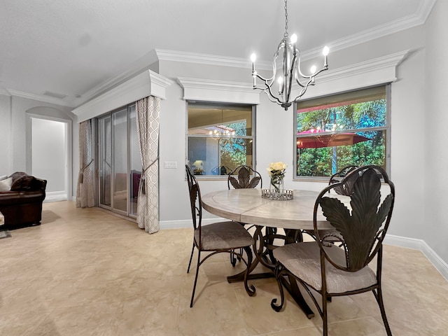 dining room with ornamental molding and an inviting chandelier