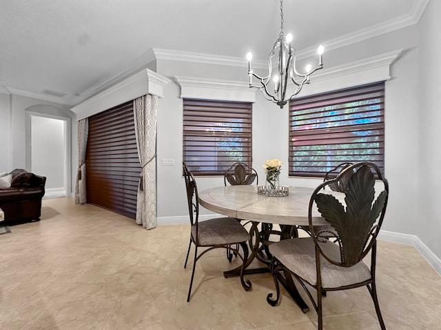 dining area with crown molding and a notable chandelier