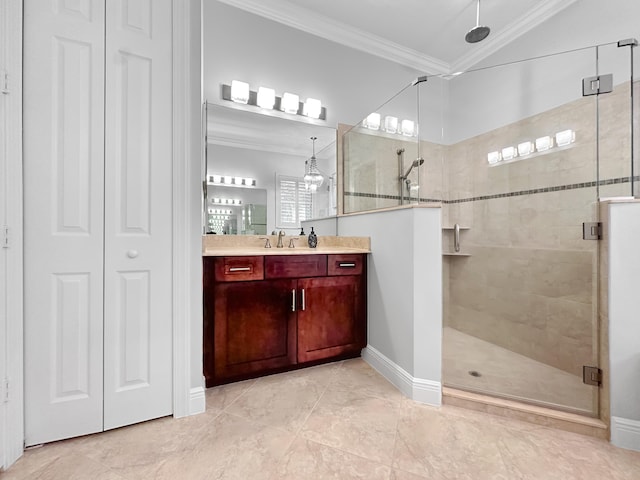 bathroom with a shower with door, vanity, and ornamental molding