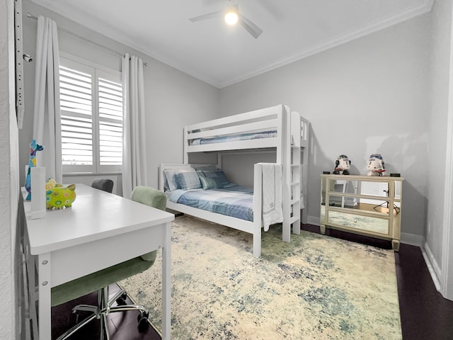 bedroom featuring ornamental molding, hardwood / wood-style flooring, and ceiling fan