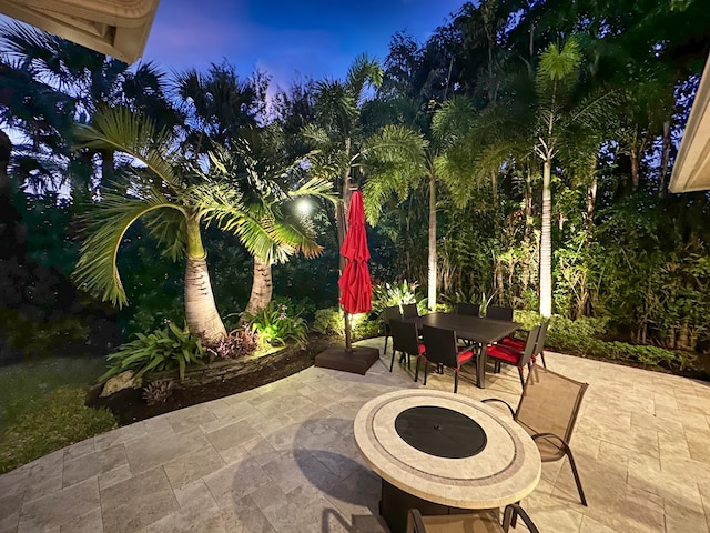 view of patio terrace at dusk