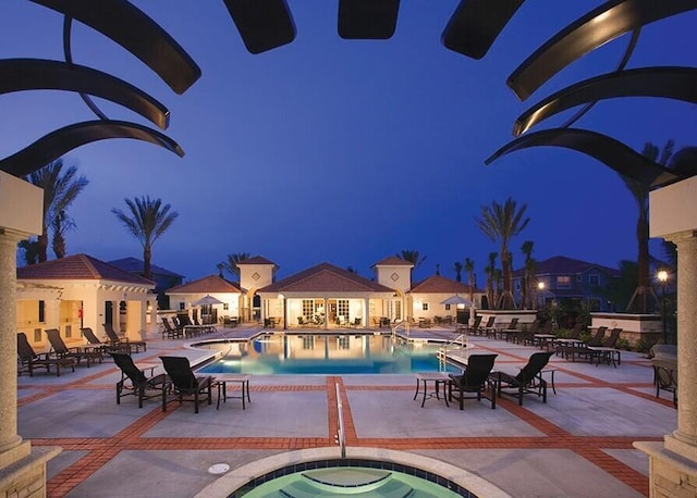 view of pool with a patio area and a community hot tub