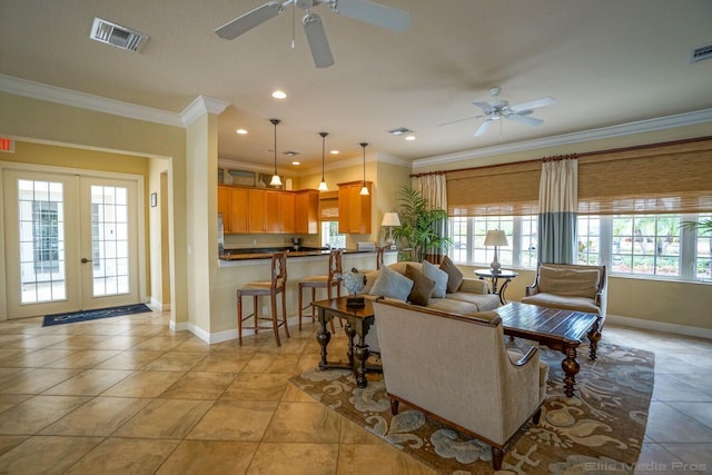 living room featuring ornamental molding, french doors, light tile patterned flooring, and ceiling fan