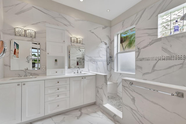 bathroom with vanity, a shower, and plenty of natural light