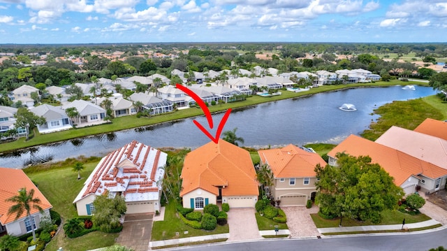 birds eye view of property with a water view