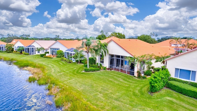 birds eye view of property with a water view