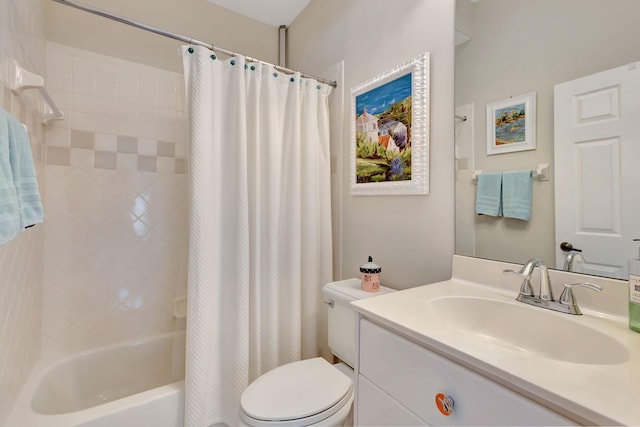 full bathroom with toilet, shower / bath combo with shower curtain, and vanity