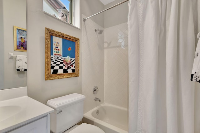 full bathroom featuring vanity, shower / tub combo, and toilet