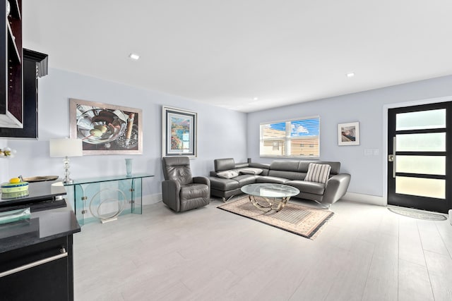 living room with light hardwood / wood-style flooring