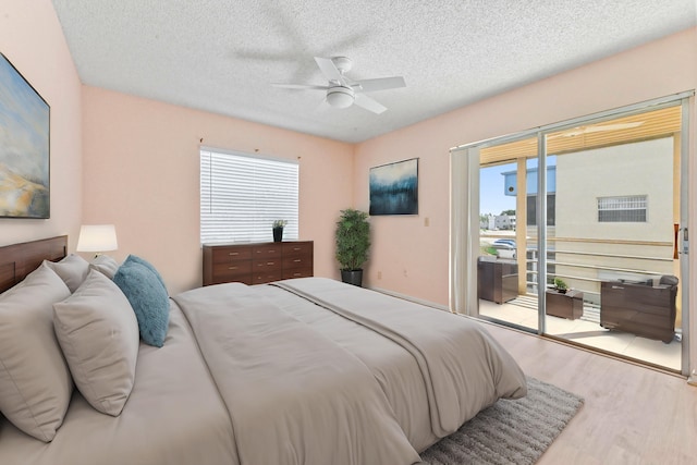 bedroom with light hardwood / wood-style flooring, multiple windows, access to outside, and ceiling fan