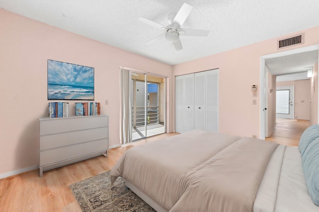 bedroom with light hardwood / wood-style floors, access to outside, a textured ceiling, and ceiling fan