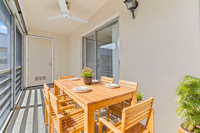 sunroom with plenty of natural light and ceiling fan