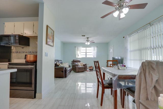 dining room featuring ceiling fan