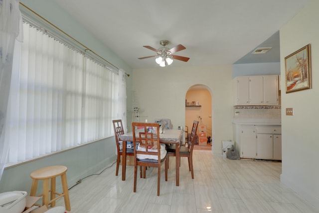 dining space with ceiling fan