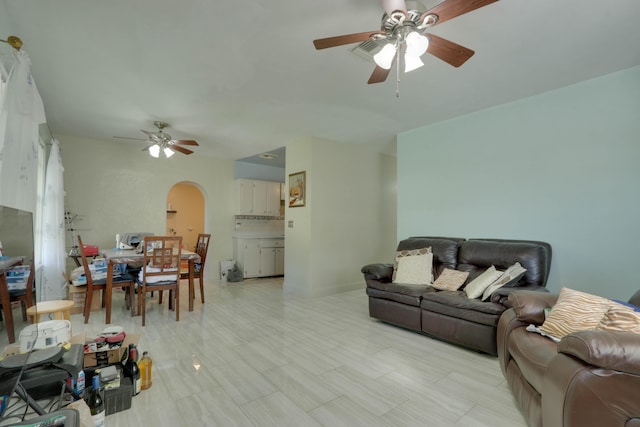 living room featuring ceiling fan