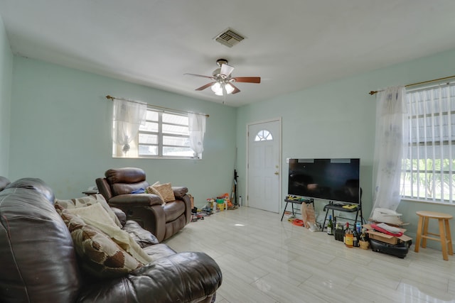 living room featuring ceiling fan