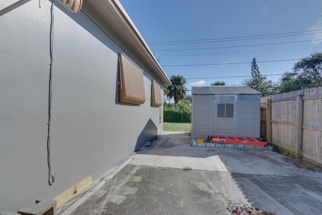 view of patio / terrace with a shed