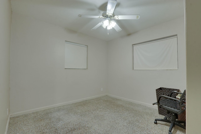 office with light carpet and ceiling fan