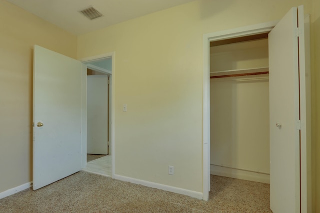 unfurnished bedroom with a closet