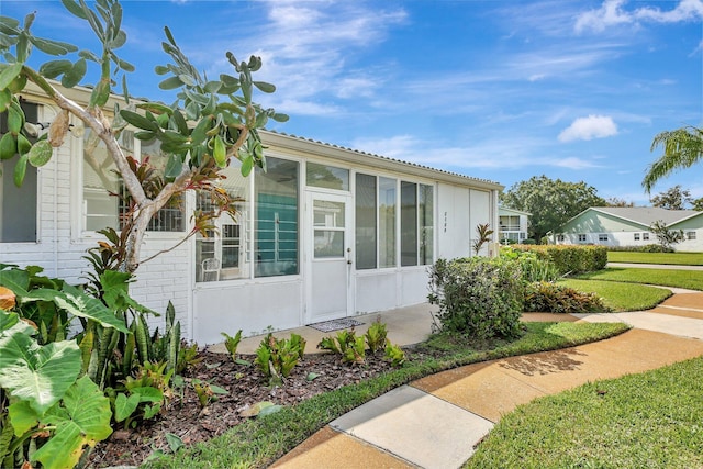 view of side of property with a yard