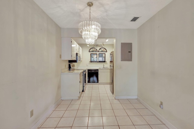 2109 SE Wayne Rd Unit 2109, Stuart, FL 34994 - kitchen featuring appliances with stainless steel finishes, electric panel, a sink, white cabinets, and light countertops