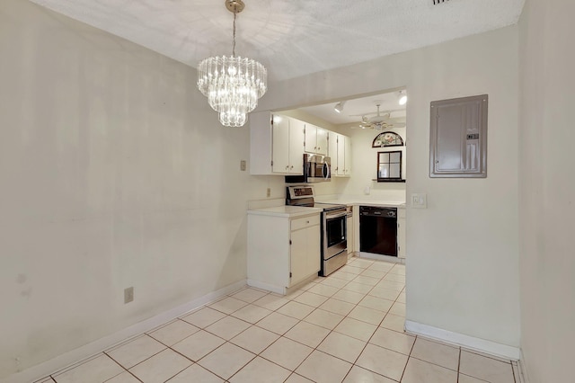 kitchen with hanging light fixtures, white cabinets, electric panel, appliances with stainless steel finishes, and a textured ceiling