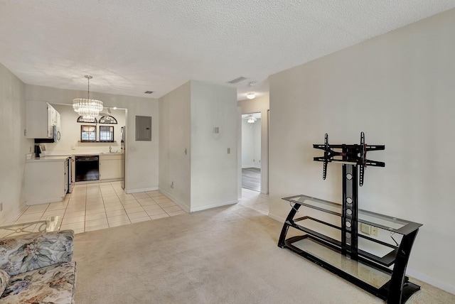 carpeted living room featuring an inviting chandelier, a textured ceiling, and sink