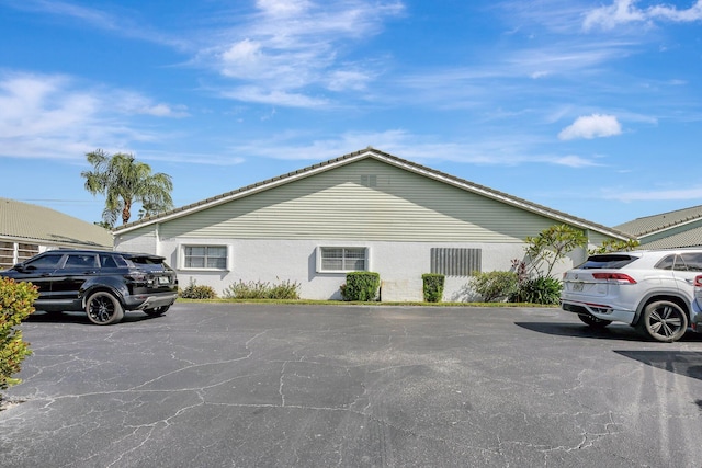 2109 SE Wayne Rd Unit 2109, Stuart, FL 34994 - view of front of home with stucco siding and uncovered parking