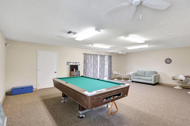 recreation room featuring a textured ceiling, carpet, and ceiling fan