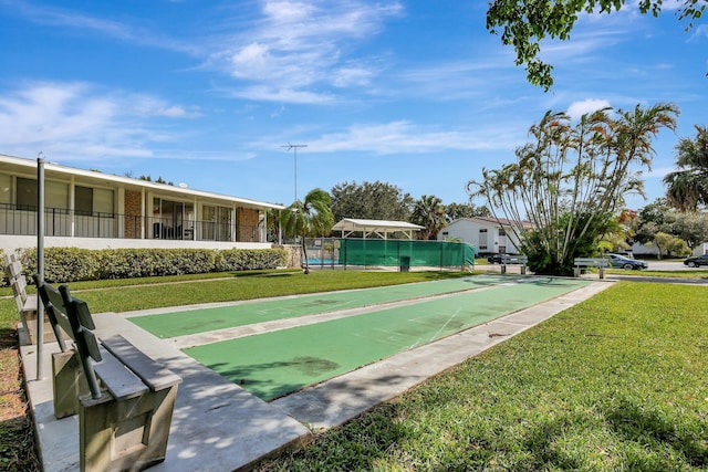 view of community featuring a yard